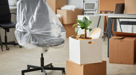 Packing furniture for moving in office